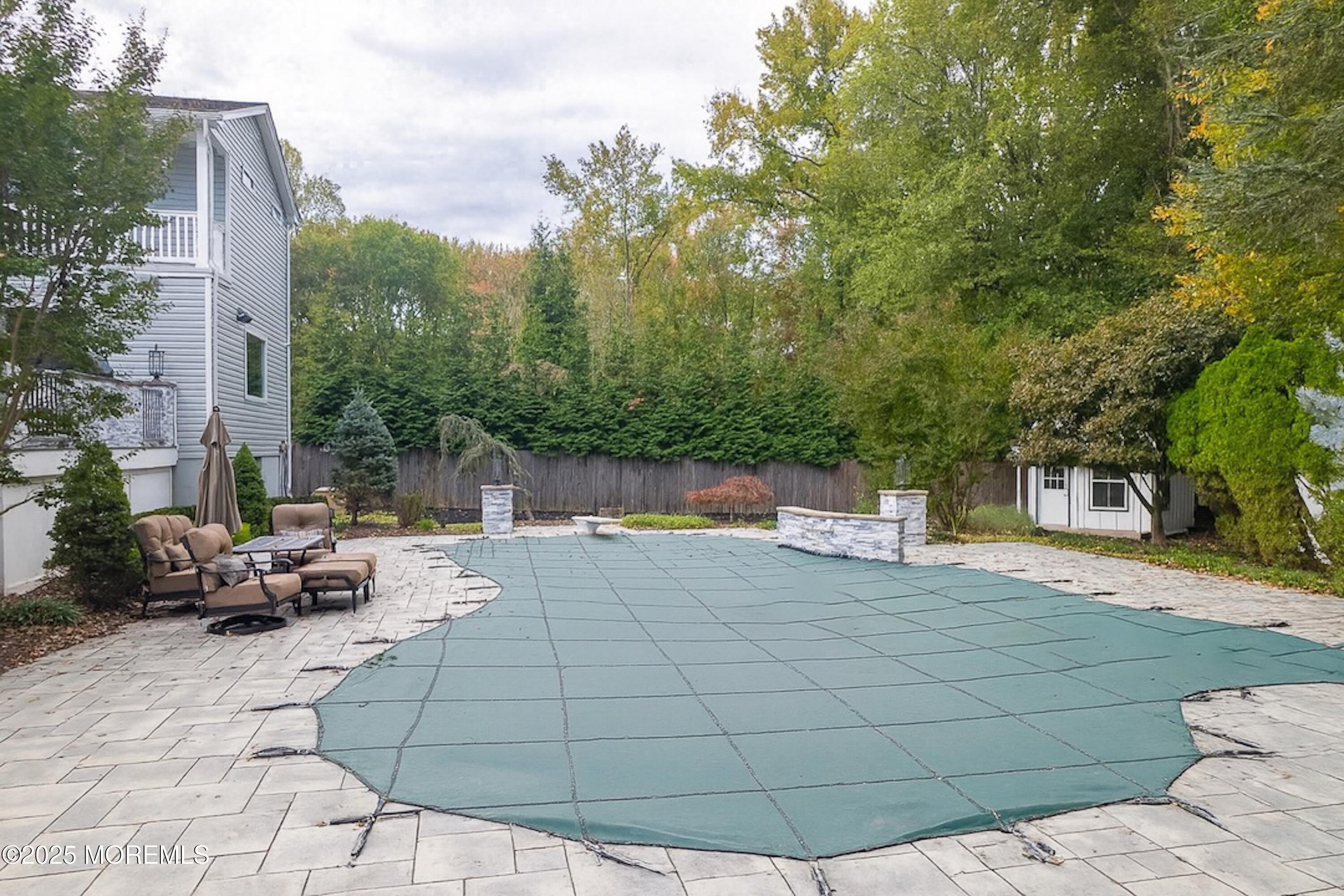 4 Garnet Street Morganville, NJ 07751 - Photo 49 of 70 a view of a yard with furniture