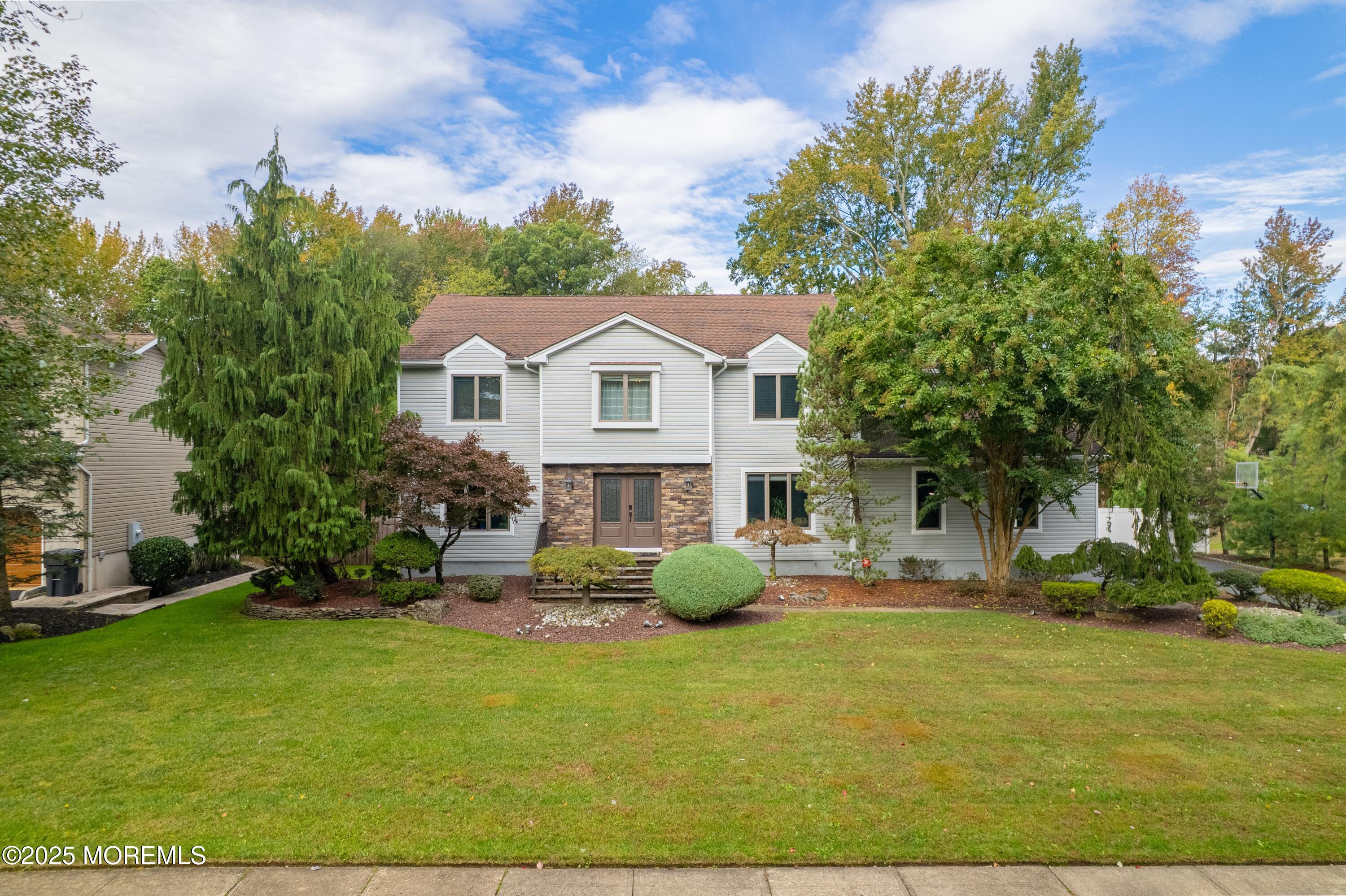 4 Garnet Street Morganville, NJ 07751 - Photo 58 of 70 a front view of a house with garden