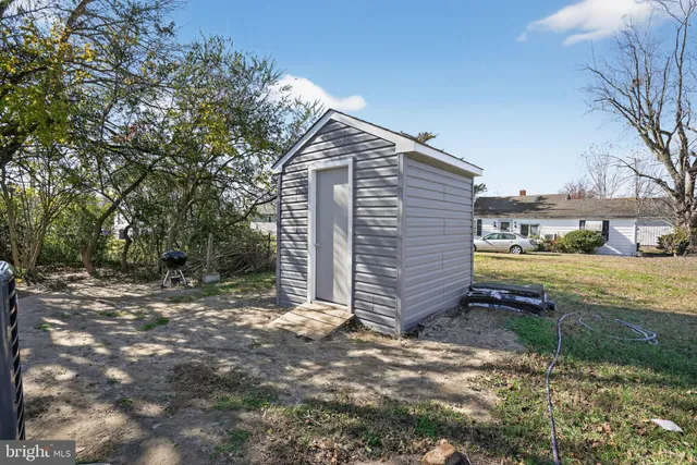 a bathroom with a toilet sink vanity tub and shower
