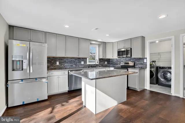 a view of kitchen with wooden floor