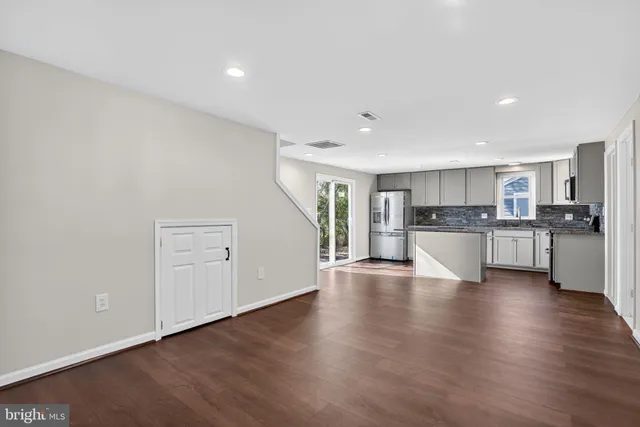 a kitchen with stainless steel appliances granite countertop a sink stove microwave and cabinets