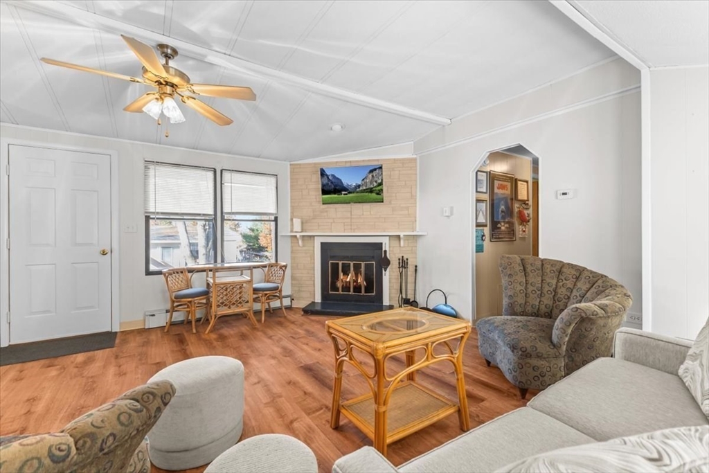 5 Presidents Way Carver, MA 02330 - Photo 14 of 30 a living room with furniture a large window and a fireplace