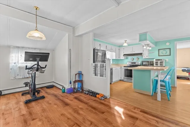 a view of a kitchen and dining room