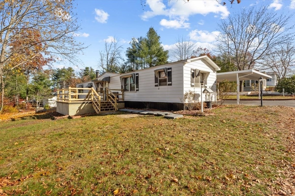 5 Presidents Way Carver, MA 02330 - Photo 2 of 30 a front view of a house with a yard