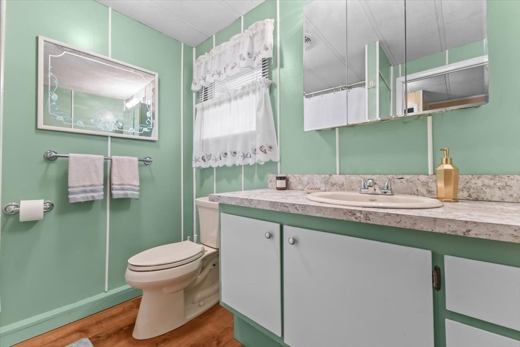 5 Presidents Way Carver, MA 02330 - Photo 21 of 30 a bathroom with a toilet sink and mirror