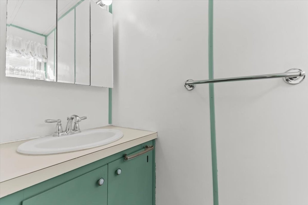 5 Presidents Way Carver, MA 02330 - Photo 22 of 30 a bathroom with a sink and a mirror