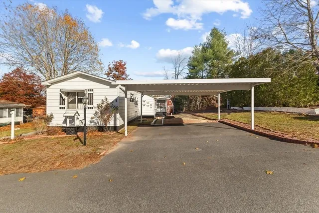 a view of a street with outdoor seating