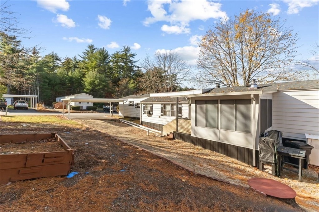 5 Presidents Way Carver, MA 02330 - Photo 27 of 30 a view of a house with backyard and sitting area