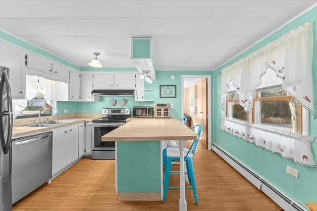 a kitchen with stainless steel appliances granite countertop a sink and cabinets