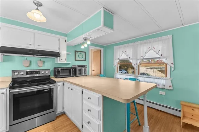 a kitchen with a stove and a sink