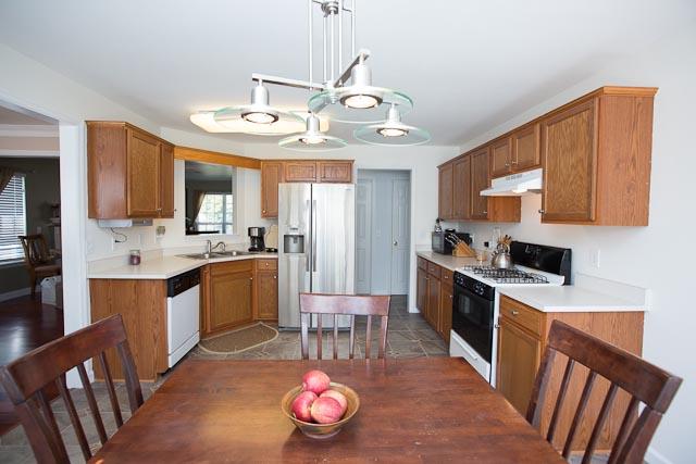 Another view of the kitchen and breakfast nook. Great layout for all types of entertaining! Refrigerator is negotiable.