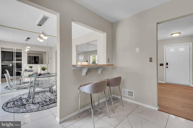 a view of a livingroom with table and chair