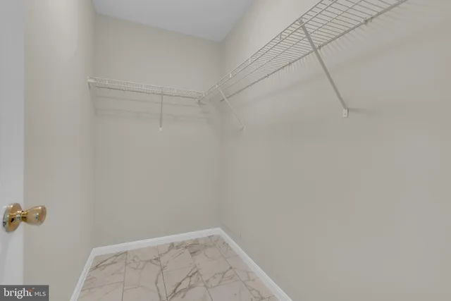 a view of a room with racks on the wall