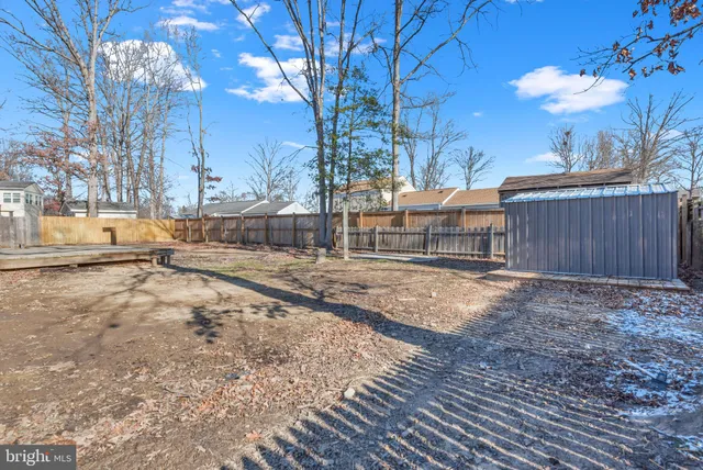 a view of a backyard of the house