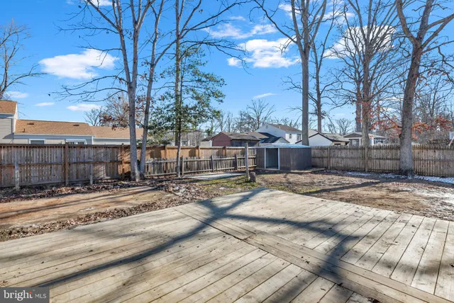 a front view of houses with yard