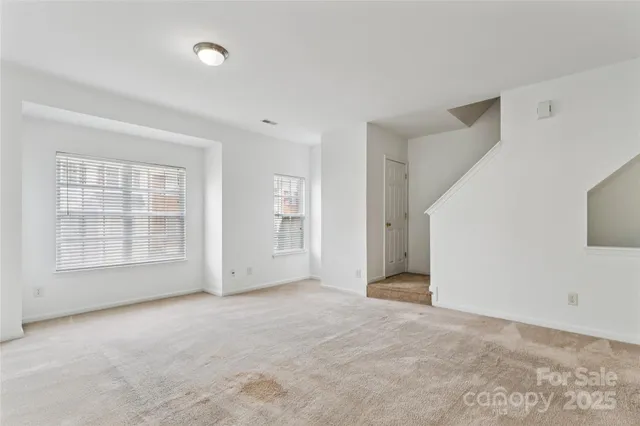 a view of empty room with windows