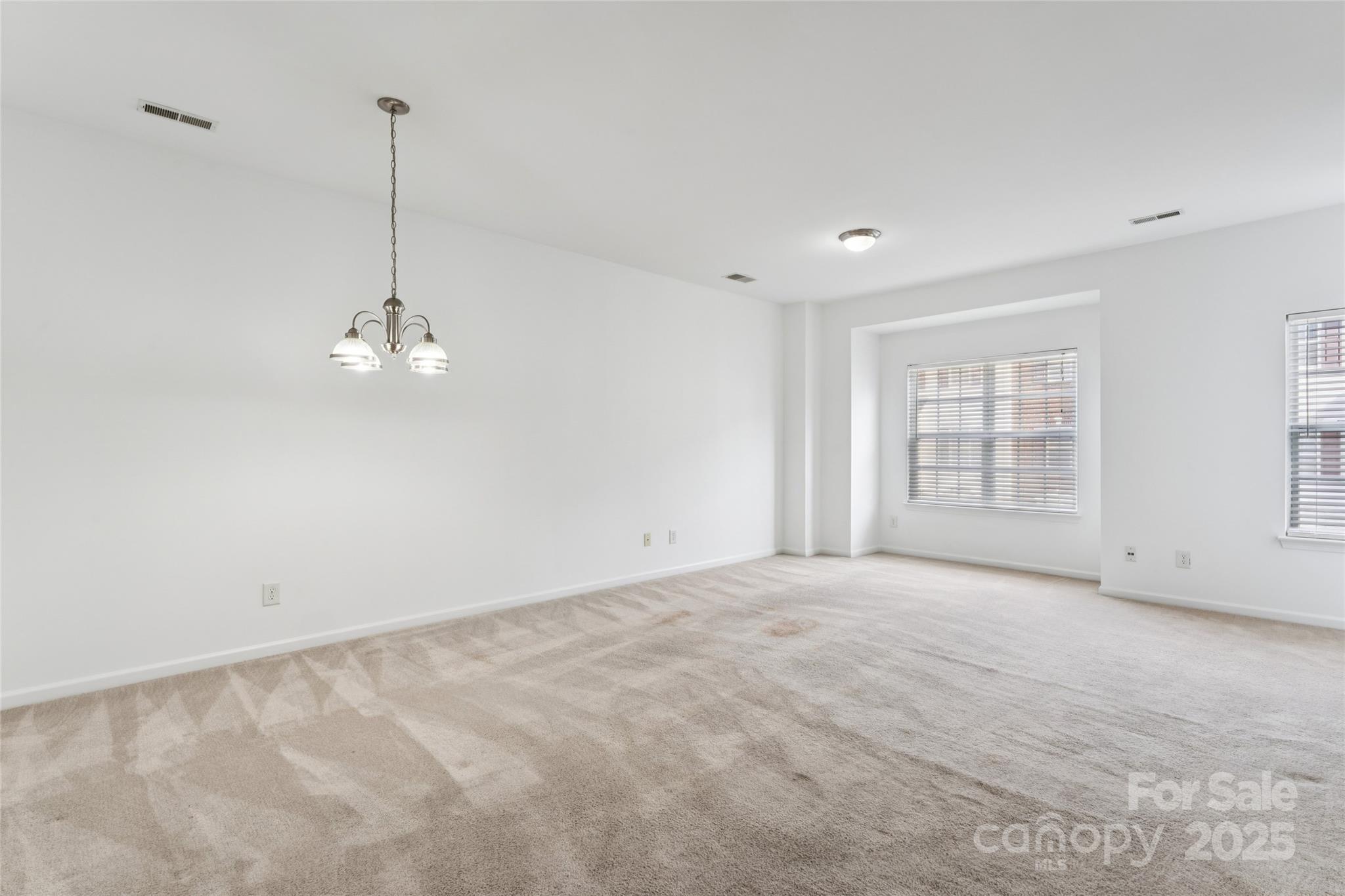 10032 Treeside Lane Matthews, NC 28105 - Photo 12 of 43 a view of empty room with windows