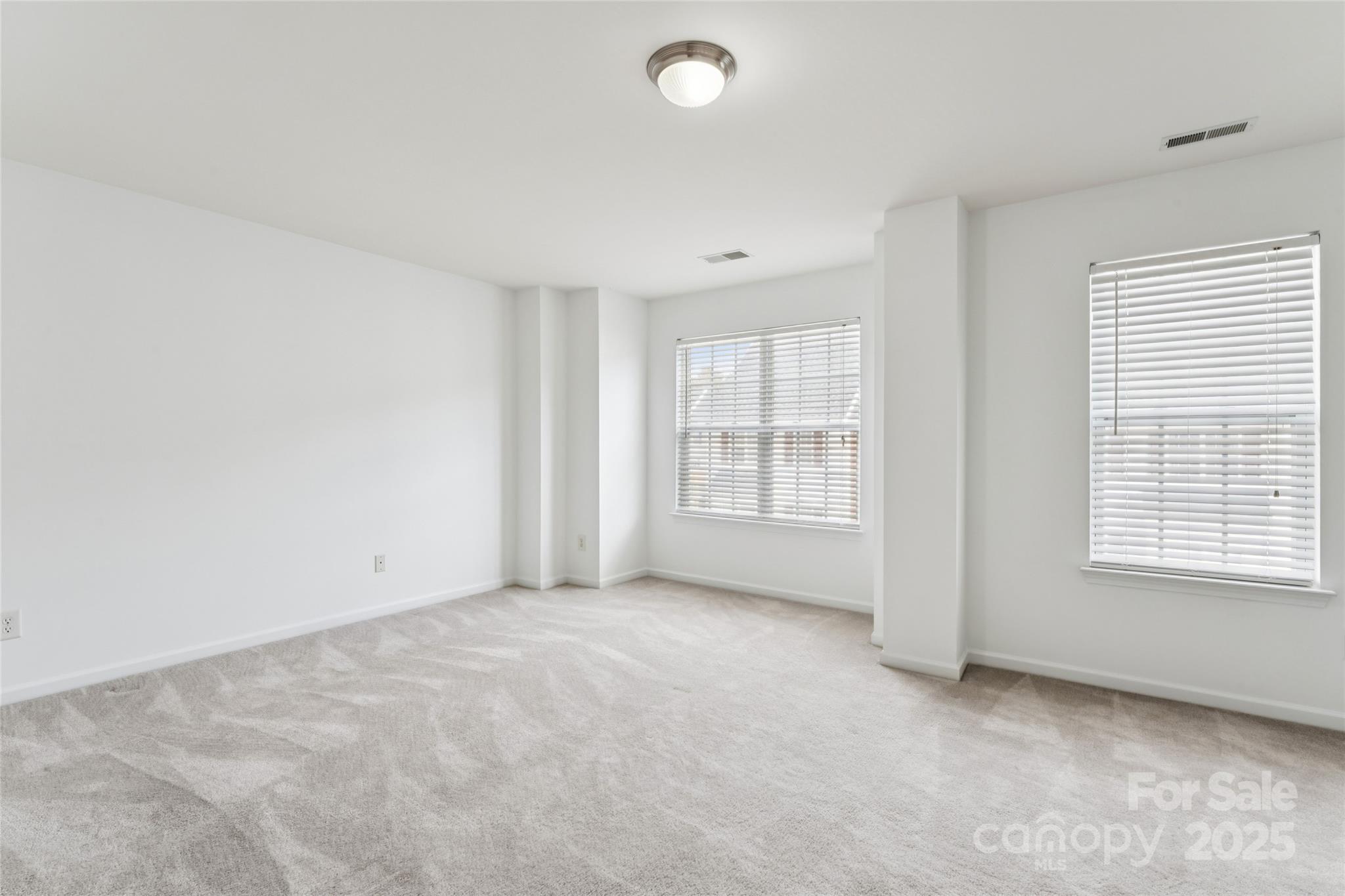 10032 Treeside Lane Matthews, NC 28105 - Photo 13 of 43 an empty room with windows