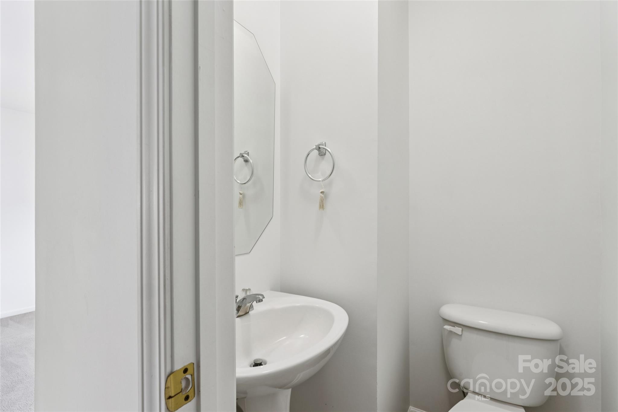 10032 Treeside Lane Matthews, NC 28105 - Photo 14 of 43 a bathroom with a toilet sink and shower