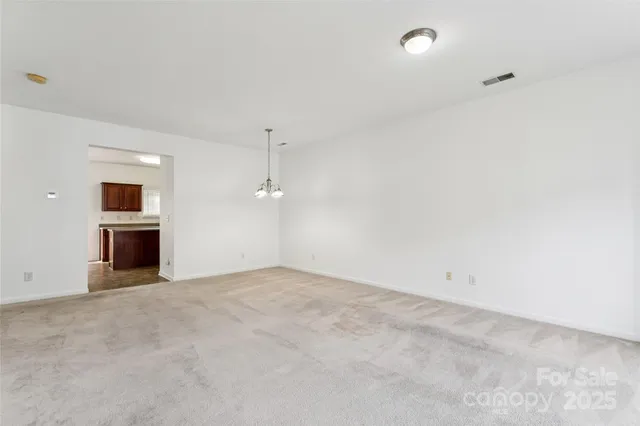 a kitchen with stainless steel appliances granite countertop a sink stove and microwave