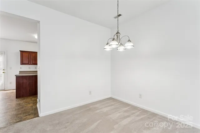 a kitchen with a sink cabinets and window