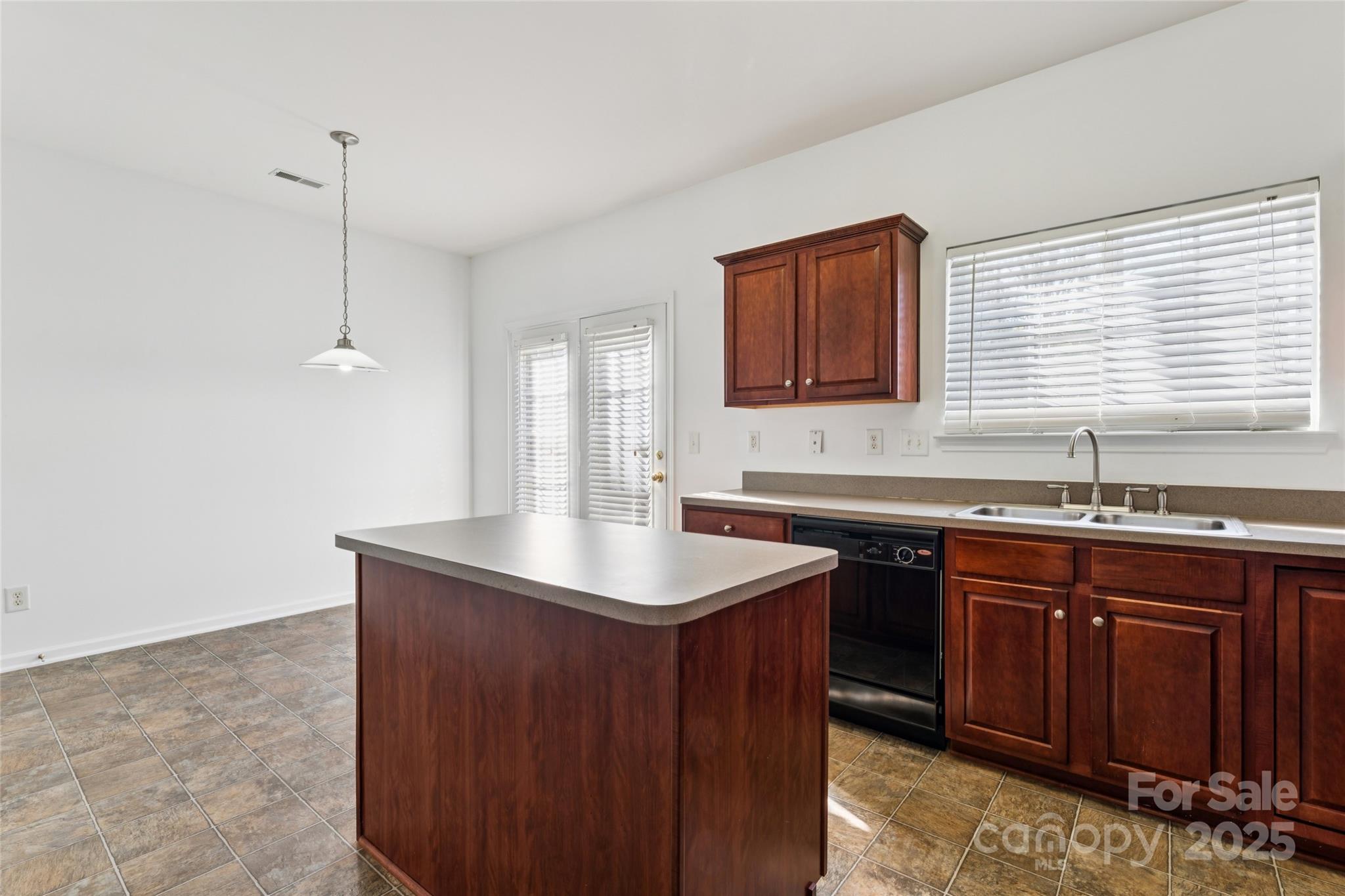 10032 Treeside Lane Matthews, NC 28105 - Photo 19 of 43 a kitchen with a sink cabinets and window