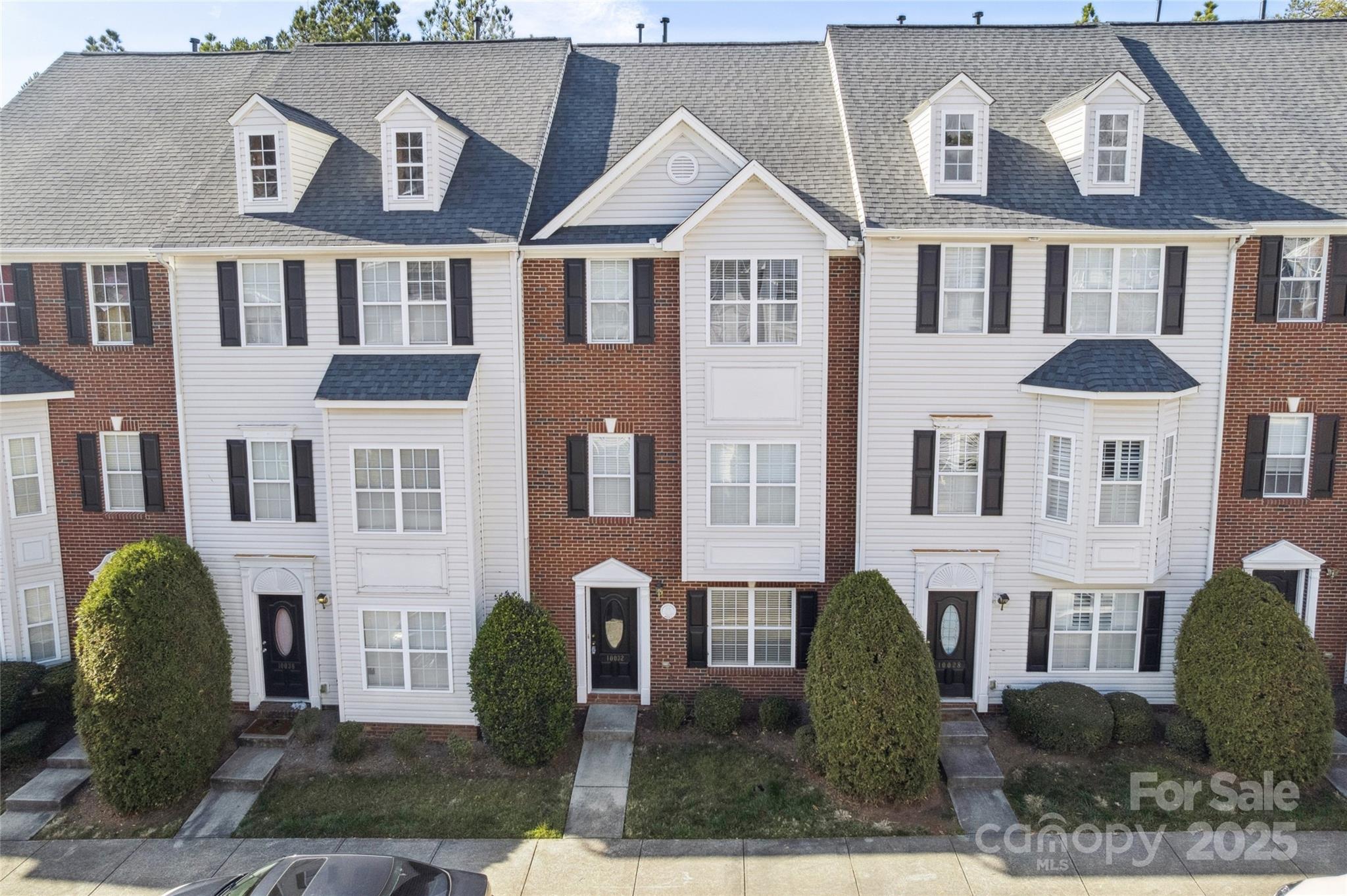 10032 Treeside Lane Matthews, NC 28105 - Photo 2 of 43 a front view of a residential houses with yard