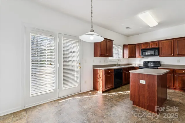 a view of storage and utility room with washer and dryer