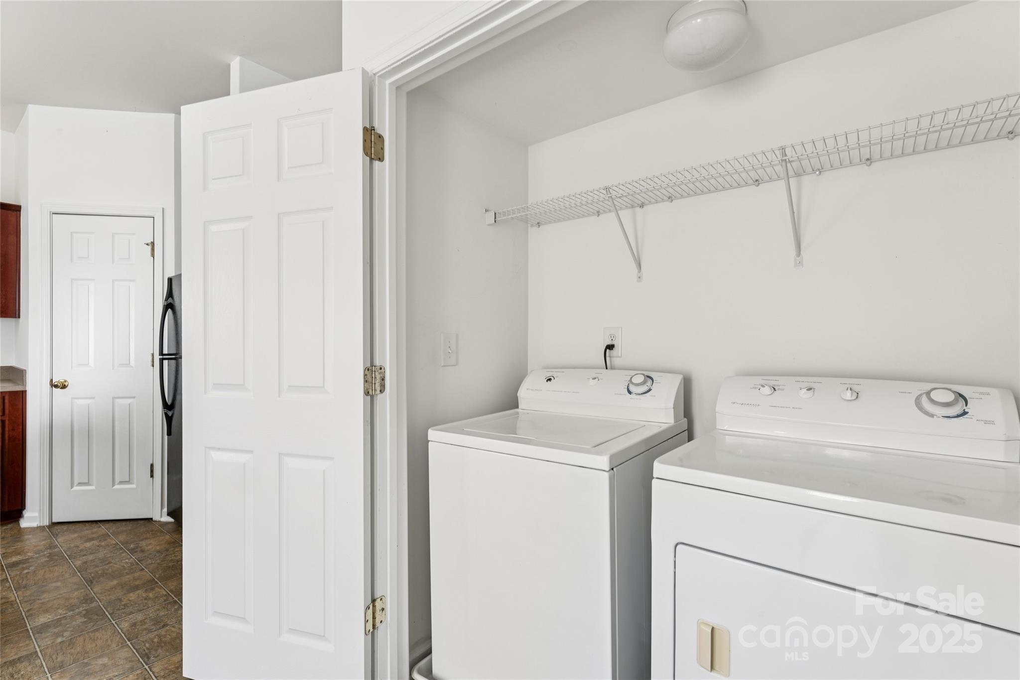 10032 Treeside Lane Matthews, NC 28105 - Photo 25 of 43 a view of storage and utility room with washer and dryer