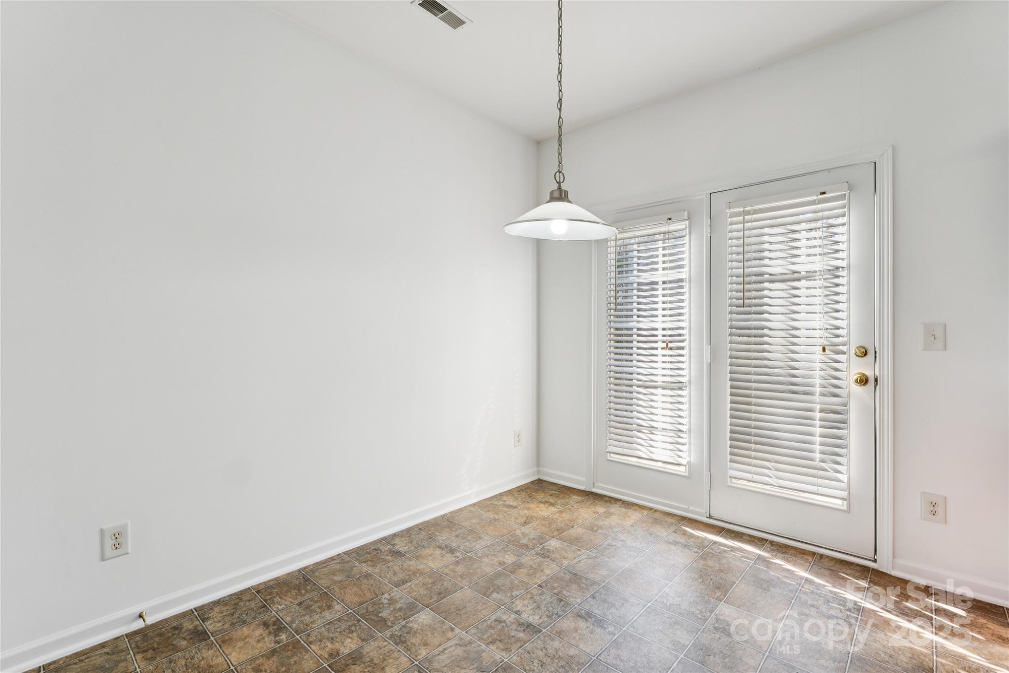 10032 Treeside Lane Matthews, NC 28105 - Photo 27 of 43 a view of an empty room with a window