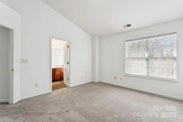 a bathroom with a bathtub shower sink vanity and toilet