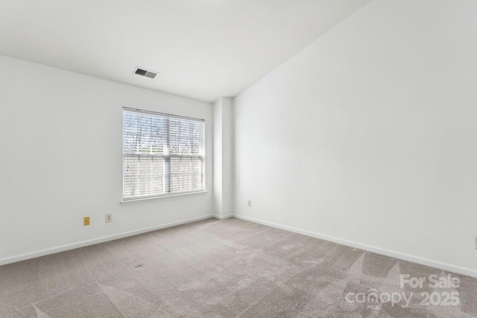 10032 Treeside Lane Matthews, NC 28105 - Photo 31 of 43 an empty room with a window