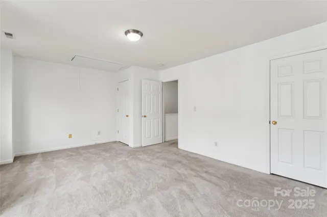 a front view of a residential apartment building with a yard