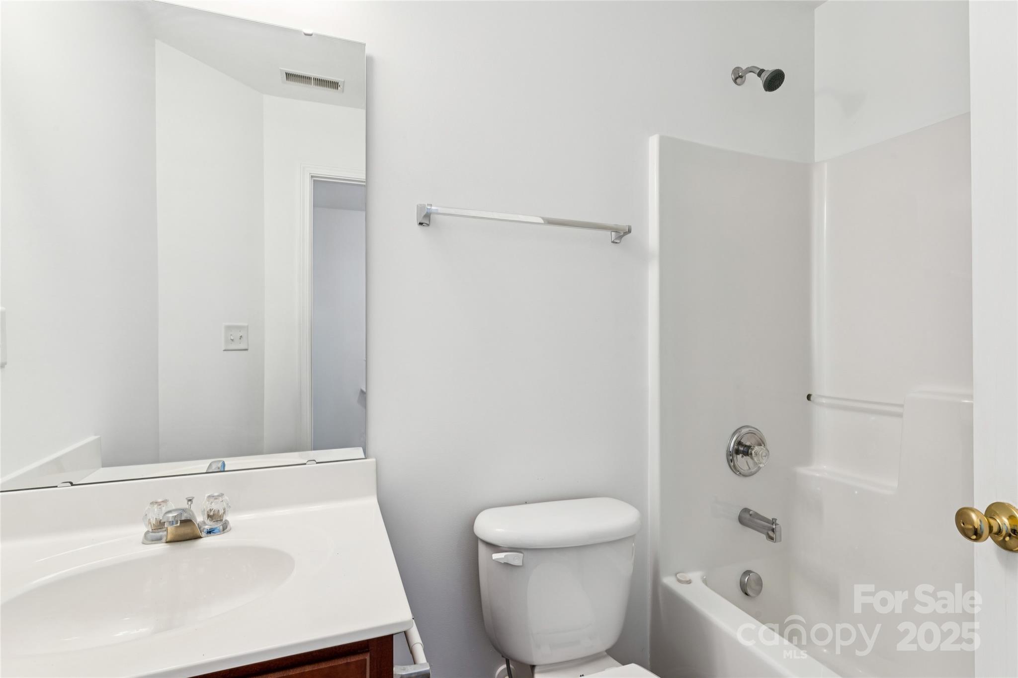 10032 Treeside Lane Matthews, NC 28105 - Photo 36 of 43 a bath room with a toilet a sink and a bath tub