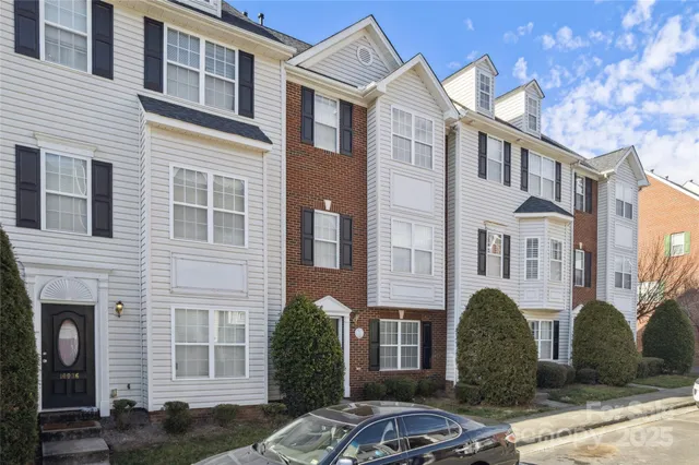 a front view of a building with parking space