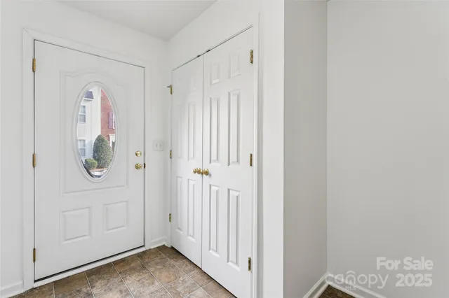 a view of an entryway with wooden floor