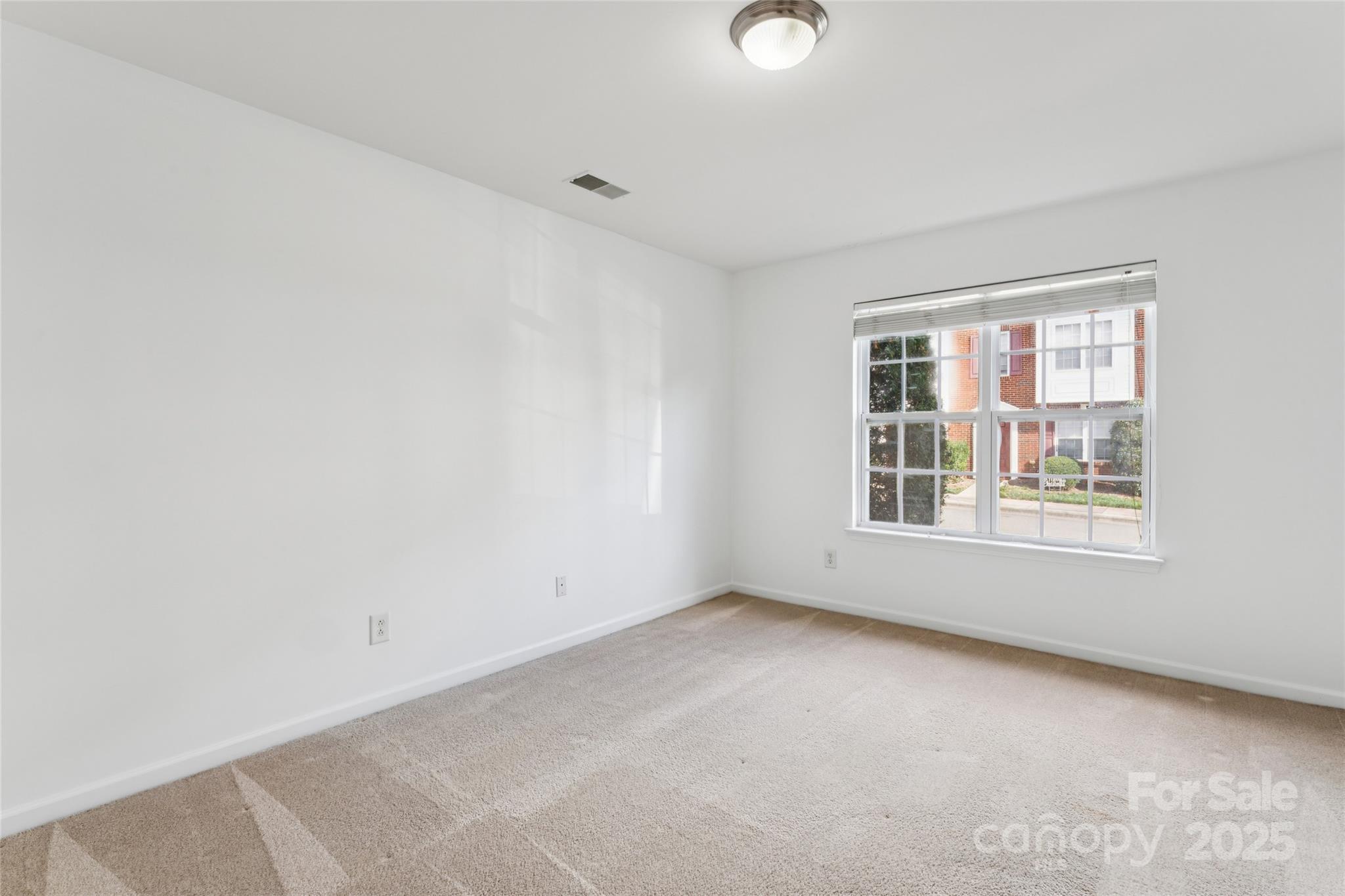 10032 Treeside Lane Matthews, NC 28105 - Photo 7 of 43 an empty room with a window