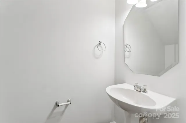 a bathroom with a sink and mirror