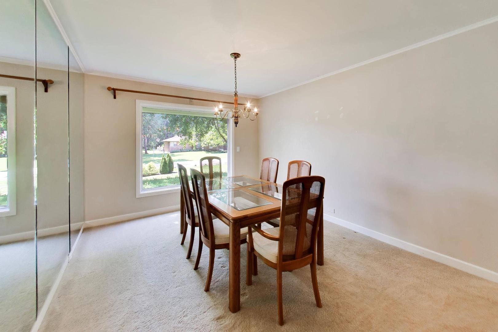 103 Cottonwood Road Northbrook, IL 60062 - Photo 6 of 50 a dining room with furniture a chandelier and window