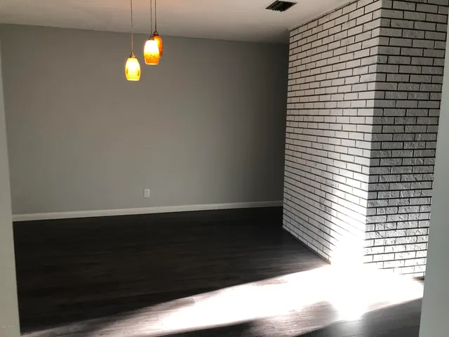 a view of kitchen and hall with a window