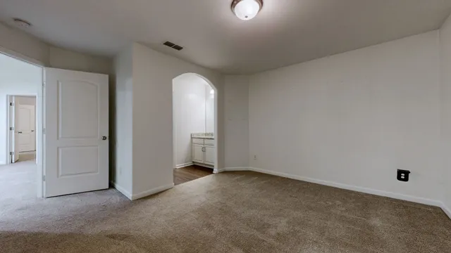 an empty room with a bathroom