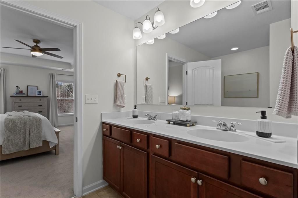 369 Franklin Lane Acworth, GA 30102 - Photo 19 of 27 a en suite bathroom with a double vanity sink double and a mirror