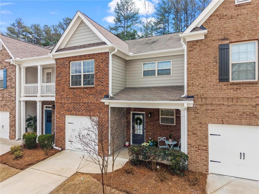 369 Franklin Lane Acworth, GA 30102 - Photo 2 of 27 a front view of a house with garden