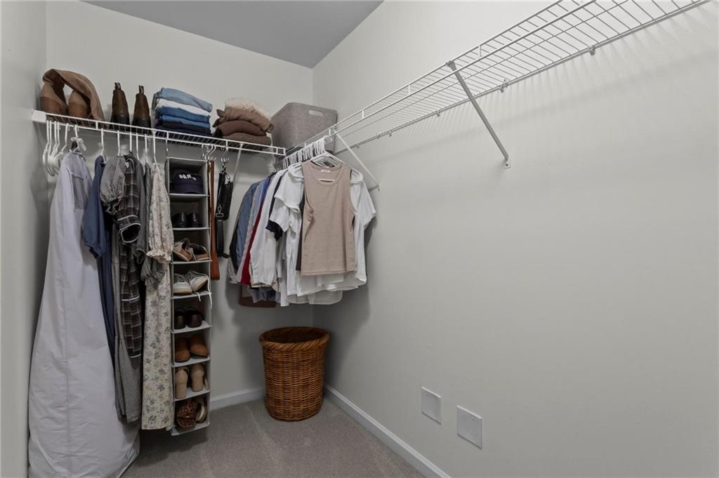 369 Franklin Lane Acworth, GA 30102 - Photo 21 of 27 a view of walk in closet with clothes and shoes
