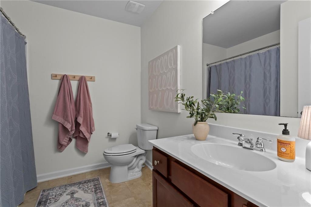 369 Franklin Lane Acworth, GA 30102 - Photo 24 of 27 a bathroom with a granite countertop sink and a toilet