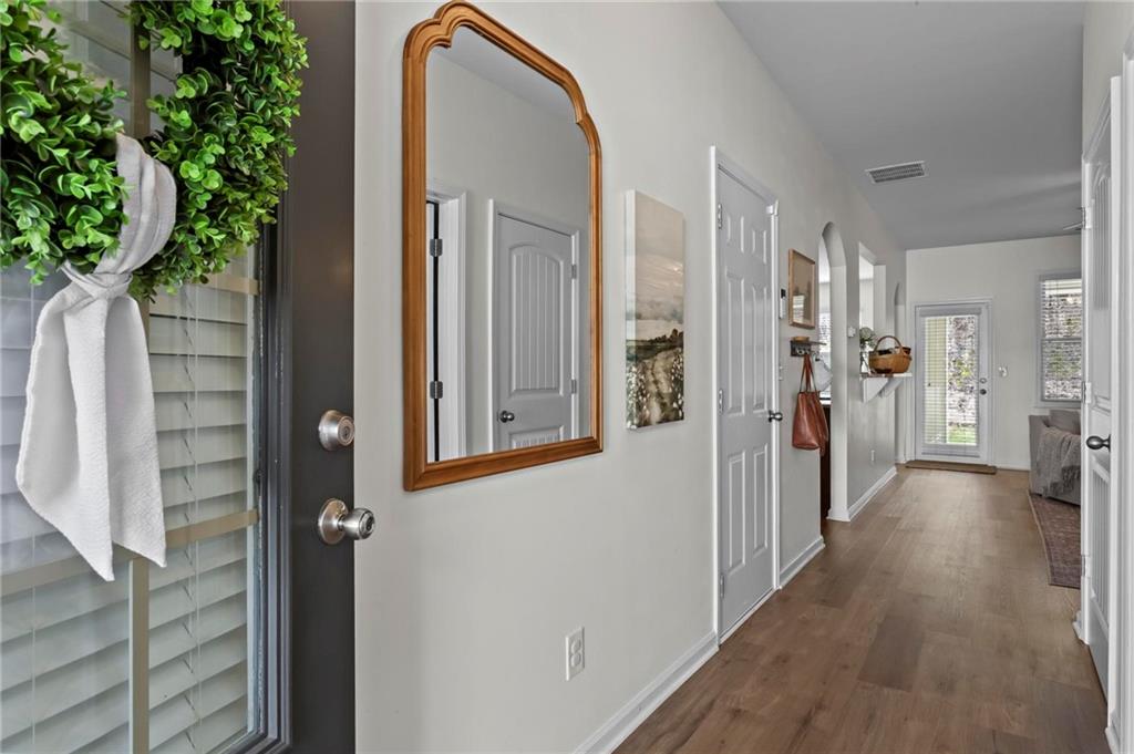 369 Franklin Lane Acworth, GA 30102 - Photo 4 of 27 a view of hallway with livingroom and wooden floor