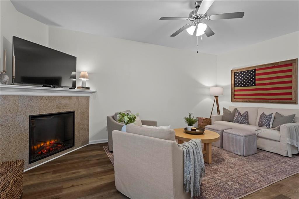369 Franklin Lane Acworth, GA 30102 - Photo 6 of 27 a living room with furniture a flat screen tv and a fireplace