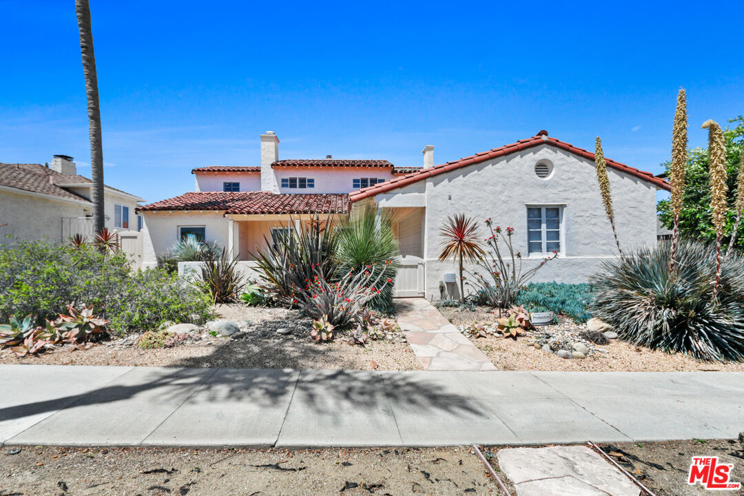3851 Olympiad Drive View Park, CA 90043 - Photo 1 of 35 a front view of a house with a yard