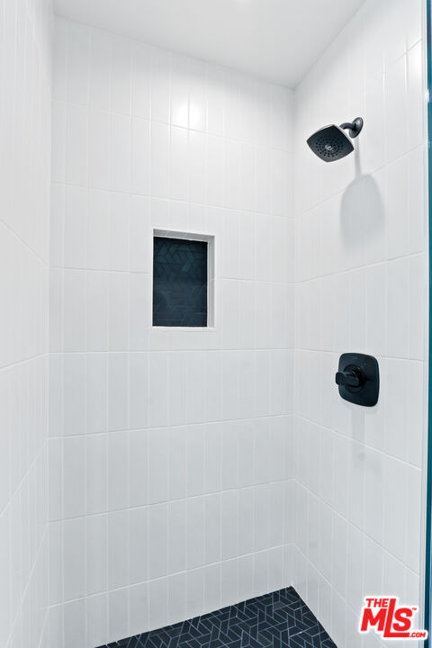 3851 Olympiad Drive View Park, CA 90043 - Photo 15 of 35 a bathroom with a shower