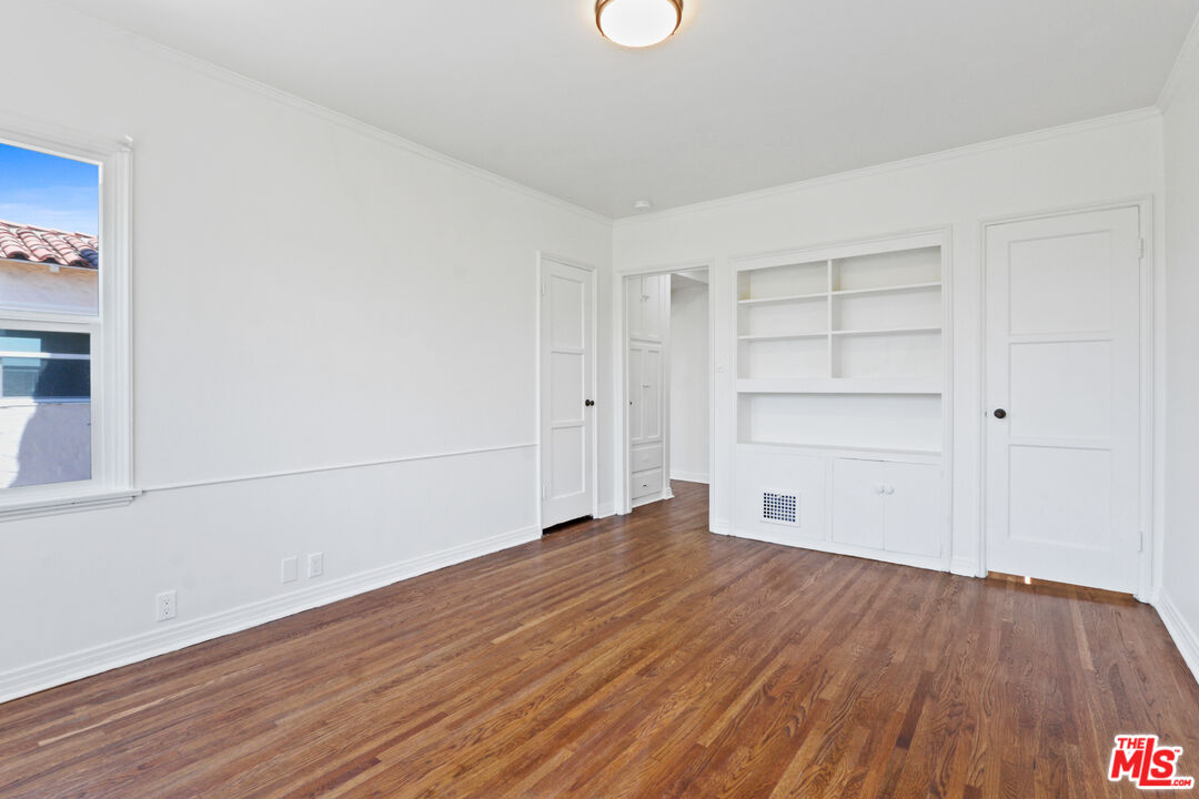 3851 Olympiad Drive View Park, CA 90043 - Photo 17 of 35 a view of empty room with wooden floor